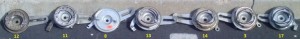 Above, the back sides of those with horse shoe springs. 12 and 11 are U-Spring, the rest are V-spring (hole kind).
